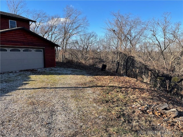 view of yard with a garage