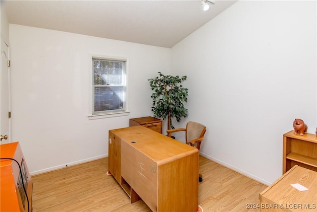 office with light hardwood / wood-style floors