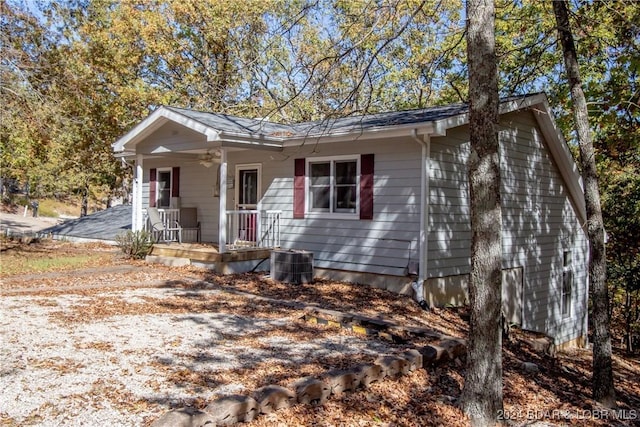 view of front of house with central AC, ceiling fan, and a porch