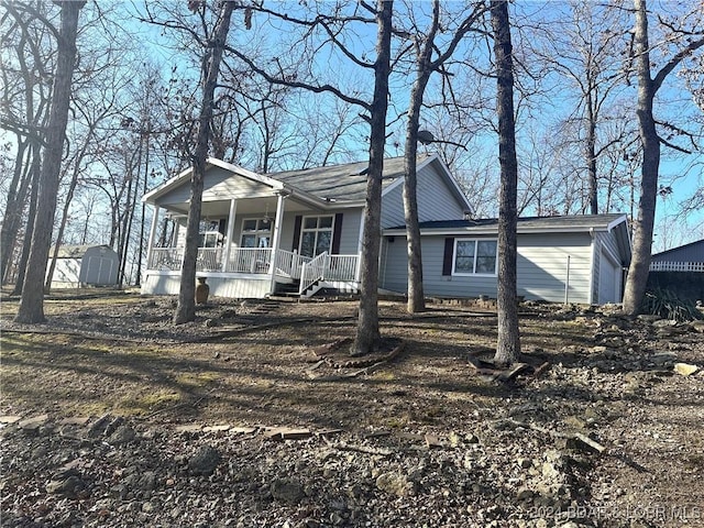 view of front of house featuring a garage and covered porch