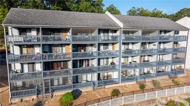 view of building exterior with fence