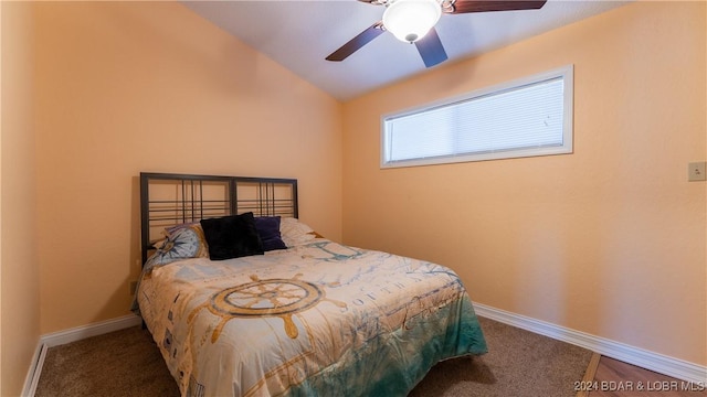 bedroom featuring lofted ceiling, carpet, baseboards, and ceiling fan