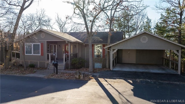 398 Moongate Dr, Osage Beach, MO 65065 - view of front of home featuring a carport and driveway