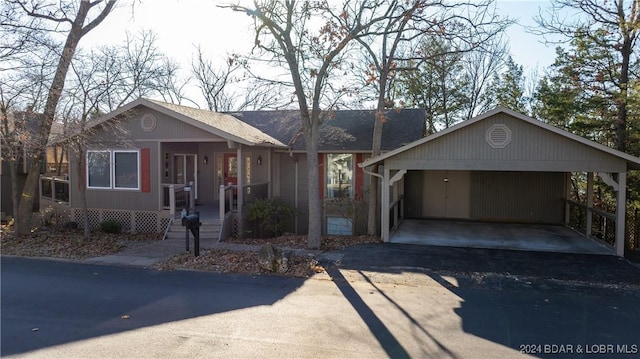 ranch-style house featuring a carport