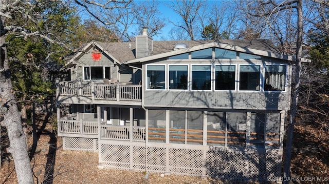 back of property featuring a sunroom