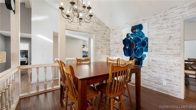 dining space featuring high vaulted ceiling, dark hardwood / wood-style floors, and a notable chandelier