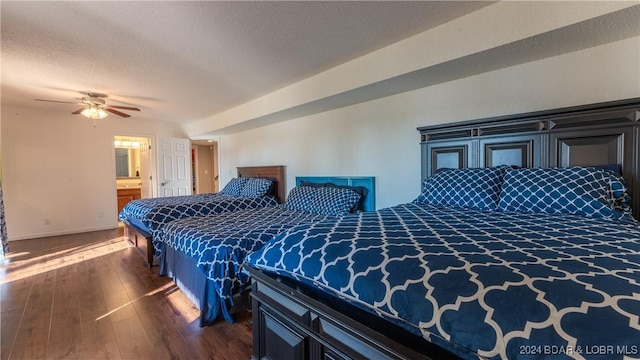 bedroom featuring a textured ceiling, ensuite bathroom, ceiling fan, and dark wood-type flooring