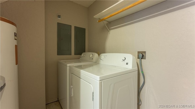 clothes washing area featuring independent washer and dryer and electric panel