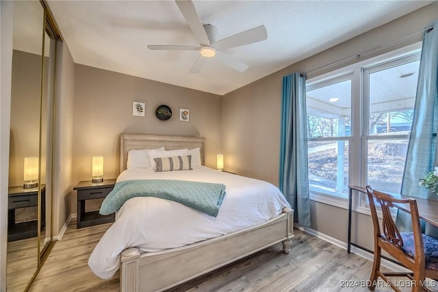 bedroom featuring ceiling fan and light wood-type flooring