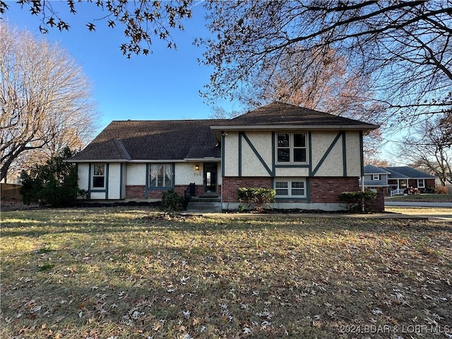 tudor house featuring a front yard