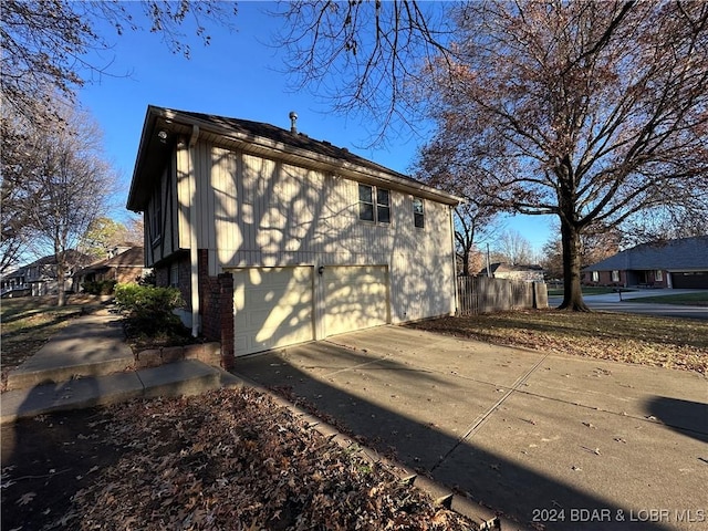 view of property exterior featuring a garage