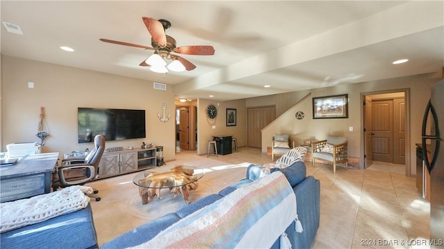 living room featuring ceiling fan and light tile patterned floors