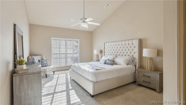 carpeted bedroom with high vaulted ceiling and ceiling fan