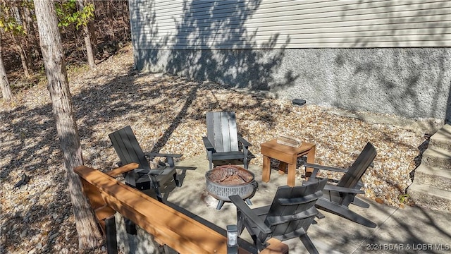 view of patio / terrace with a fire pit