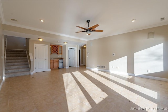 550 Grand Cove Rd, Porto Cima, MO 65079 - unfurnished living room featuring ornamental molding, ceiling fan, light tile patterned floors, baseboards, and stairway