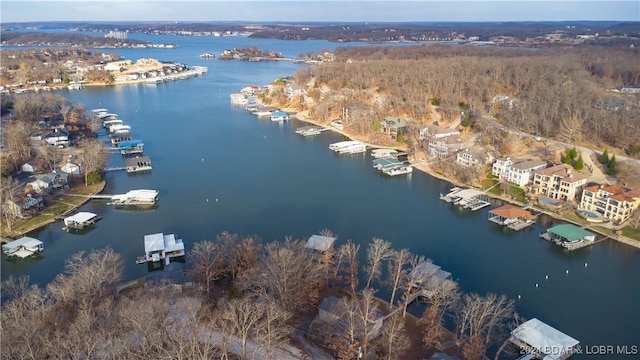 aerial view of property and surrounding area featuring a nearby body of water
