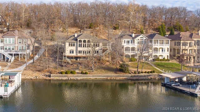 aerial perspective of suburban area featuring a nearby body of water