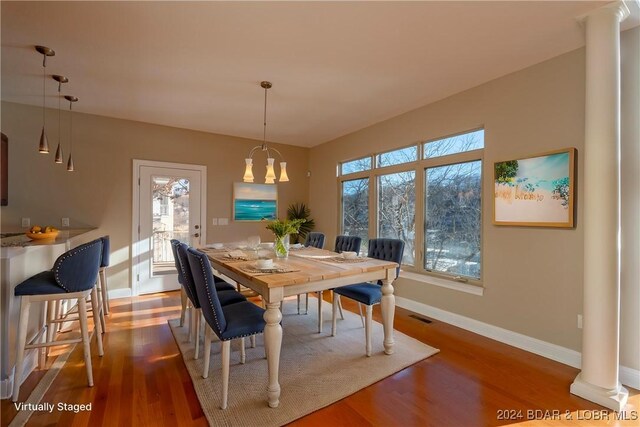 550 Grand Cove Rd, Porto Cima, MO 65079 - dining area featuring ornate columns, baseboards, and wood finished floors