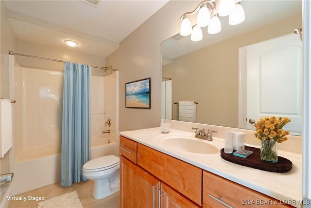 full bathroom with toilet, shower / bath combination with curtain, vanity, and tile patterned floors