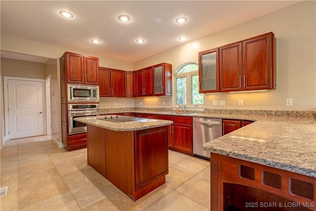 550 Grand Cove Rd, Porto Cima, MO 65079 - kitchen with stainless steel appliances, a sink, light stone countertops, glass insert cabinets, and recessed lighting