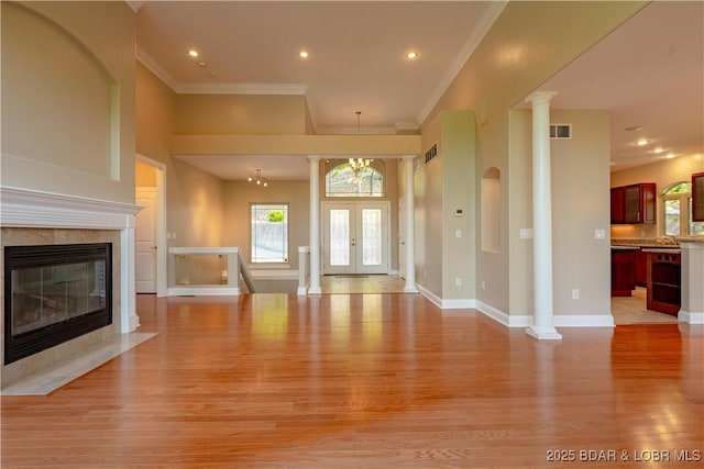 550 Grand Cove Rd, Porto Cima, MO 65079 - unfurnished living room with light wood-style flooring, ornamental molding, a high end fireplace, baseboards, and recessed lighting