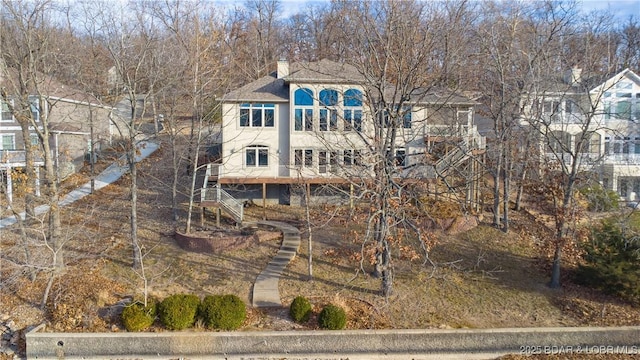 550 Grand Cove Rd, Porto Cima, MO 65079 - back of property with a chimney and roof with shingles