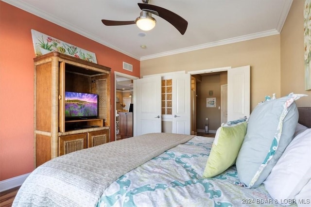 bedroom with wood-type flooring, ceiling fan, and ornamental molding