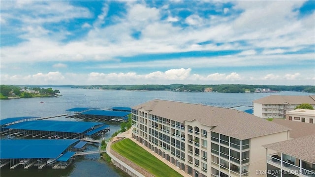 birds eye view of property featuring a water view