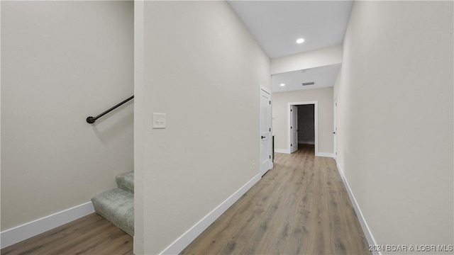 hall with light hardwood / wood-style floors