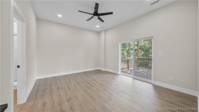 spare room featuring ceiling fan and light wood-type flooring