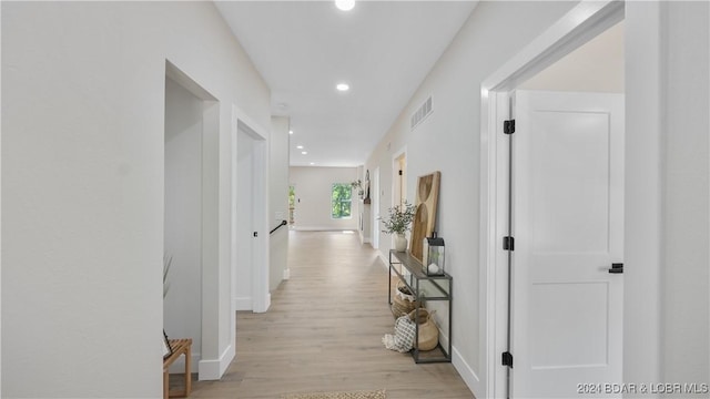 hallway with light wood-type flooring