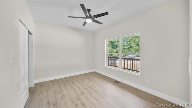 spare room with ceiling fan and light hardwood / wood-style flooring