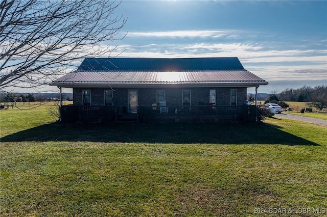 exterior space featuring a front lawn and a porch