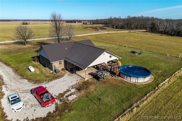 birds eye view of property featuring a rural view