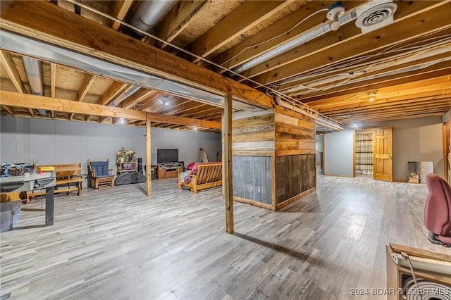 basement featuring hardwood / wood-style floors