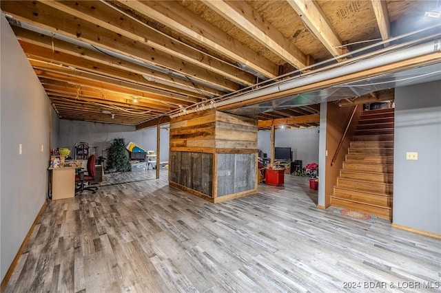 basement with wood-type flooring