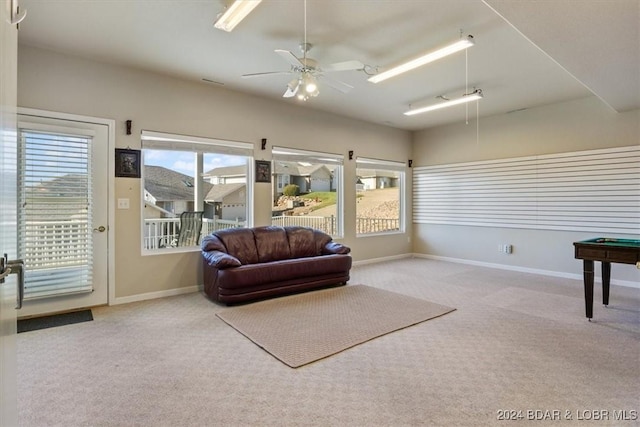 sitting room with ceiling fan and light carpet