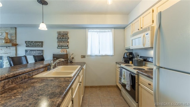 kitchen featuring sink, hanging light fixtures, white appliances, a breakfast bar, and light tile patterned flooring