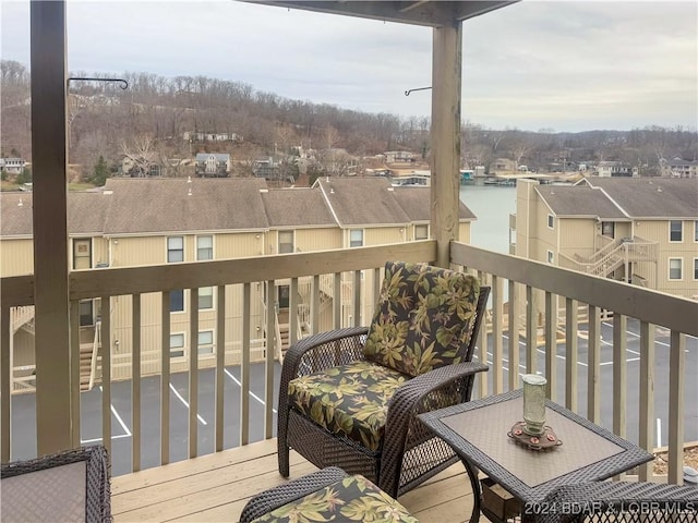 balcony featuring a water view