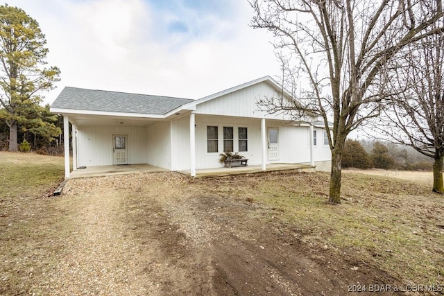 single story home featuring a carport