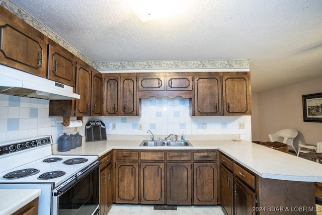 kitchen featuring sink, backsplash, range with electric cooktop, a textured ceiling, and kitchen peninsula