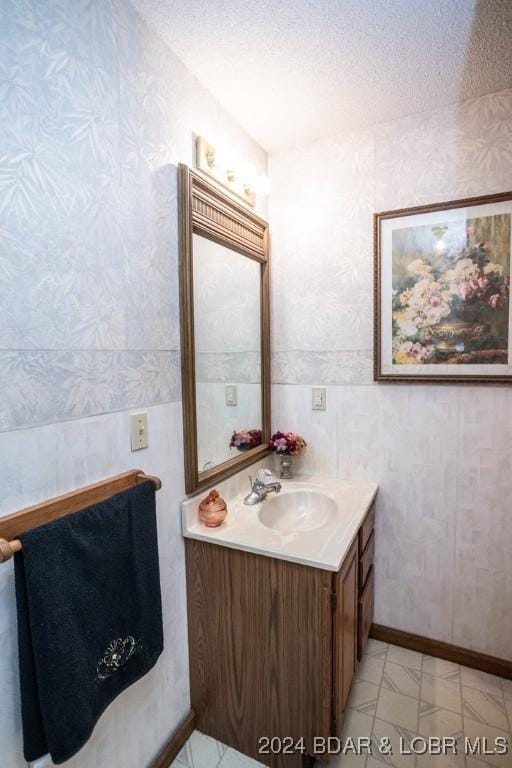 bathroom featuring vanity and a textured ceiling