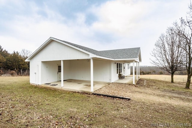 rear view of house with a yard