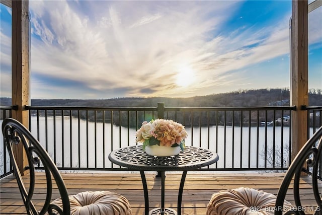 balcony featuring a water view