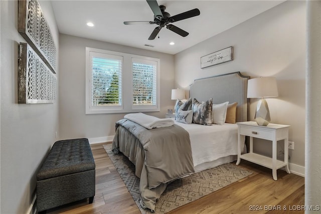 bedroom featuring light wood-type flooring and ceiling fan