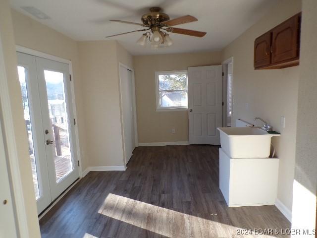 interior space featuring french doors, dark hardwood / wood-style flooring, ceiling fan, and sink