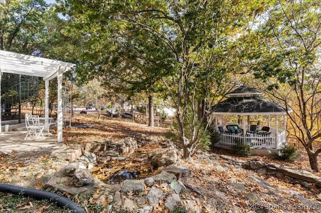 view of yard featuring a gazebo and a patio