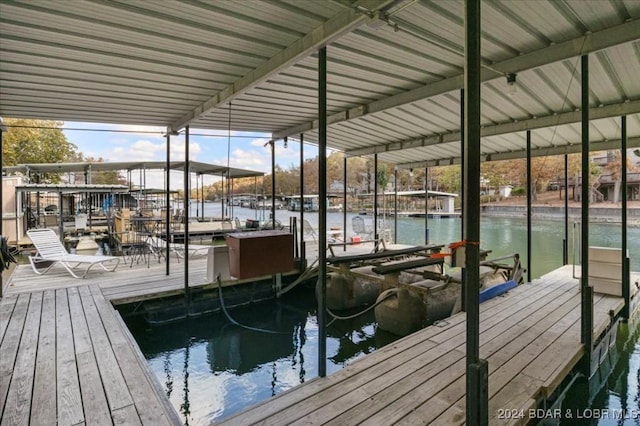 6334 Red Barn Rd, Osage Beach, MO 65065 - dock area featuring boat lift and a water view