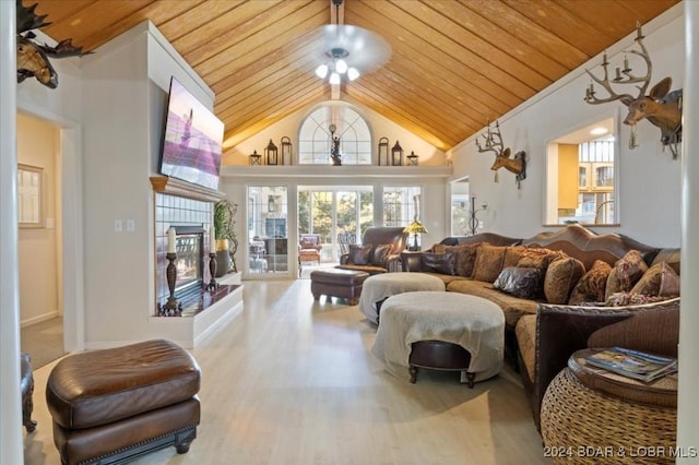 living room featuring hardwood / wood-style flooring, ceiling fan, wood ceiling, and high vaulted ceiling