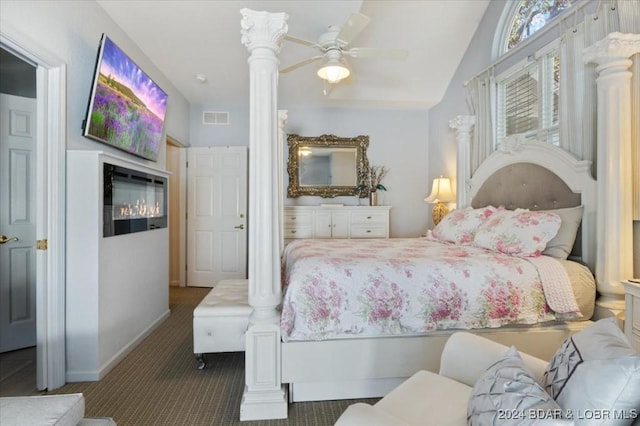 bedroom with dark carpet, ceiling fan, and lofted ceiling